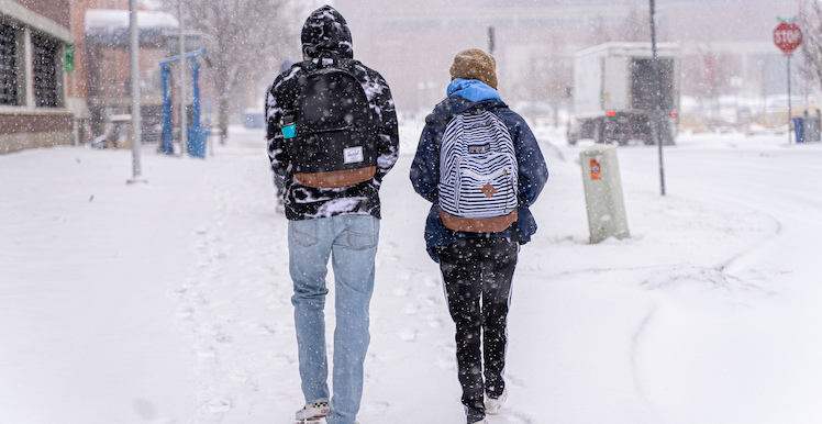 Students walking on a snowy campus