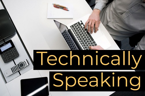 Close up of a man working on a laptop at his office desk. "Technically Speaking."