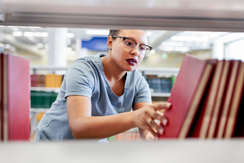 Student working in a library.