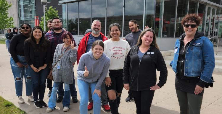 Staff senate posed outside Dazbog on Auraria campus.