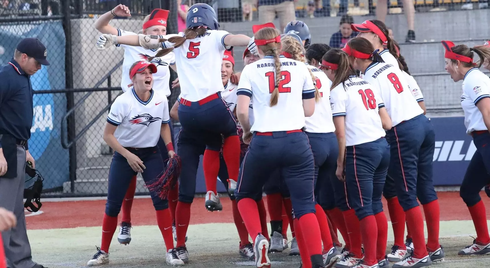 MSU Denver outfielder Shelby Robb celebrates with teammates on the Roadrunners softball team.