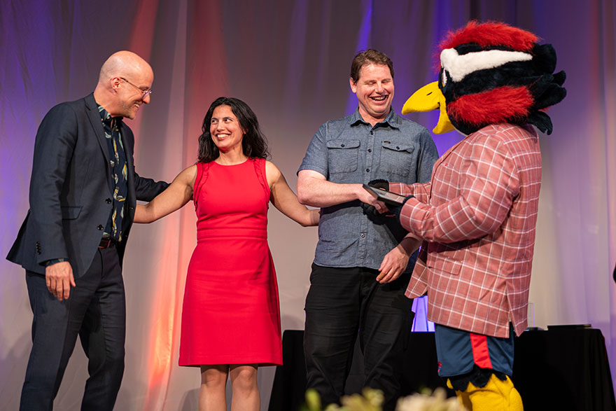 MSU Denver employees celebrate Roadrunners Who Soar Awards with the MSU Denver mascot, Rowdy.