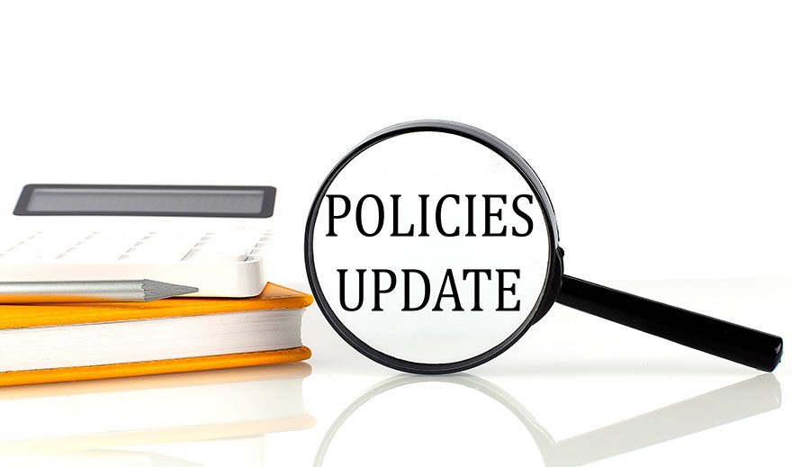 Graphic depicting magnifying glass over the words "policies update"