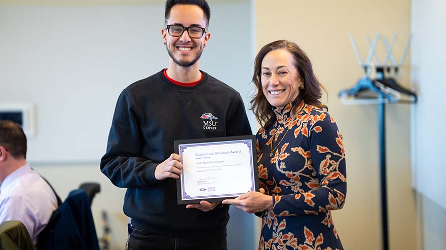 Student Roadrunner Shoutout Award winner Juan Manuel Gonzalez with MSU Denver President, Janine Davidson, Ph.D.