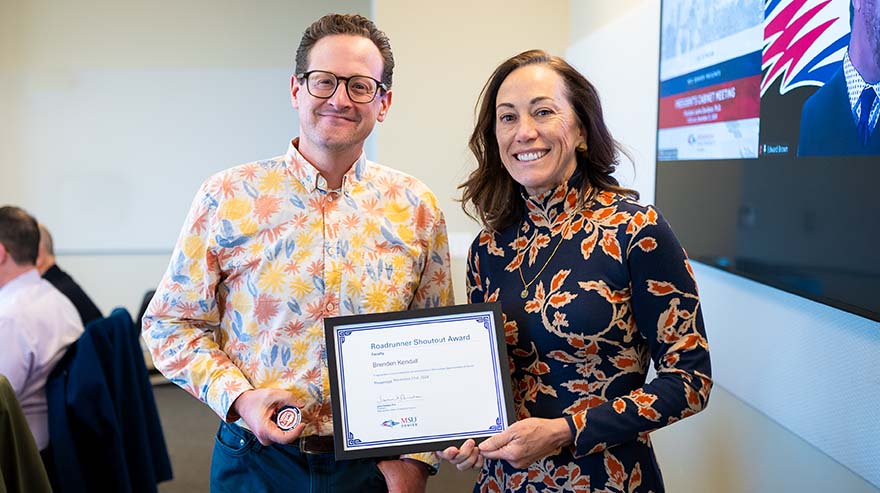 Faculty Roadrunner Shoutout Award winner, Brenden Kendall with MSU Denver President, Janine Davidson, Ph.D.