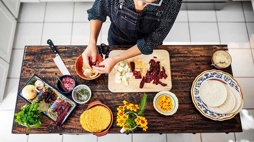 Food anthropologist and chef Paula Thomas prepares ingredients for adobo sauce to flavor pozole rojo at her home.