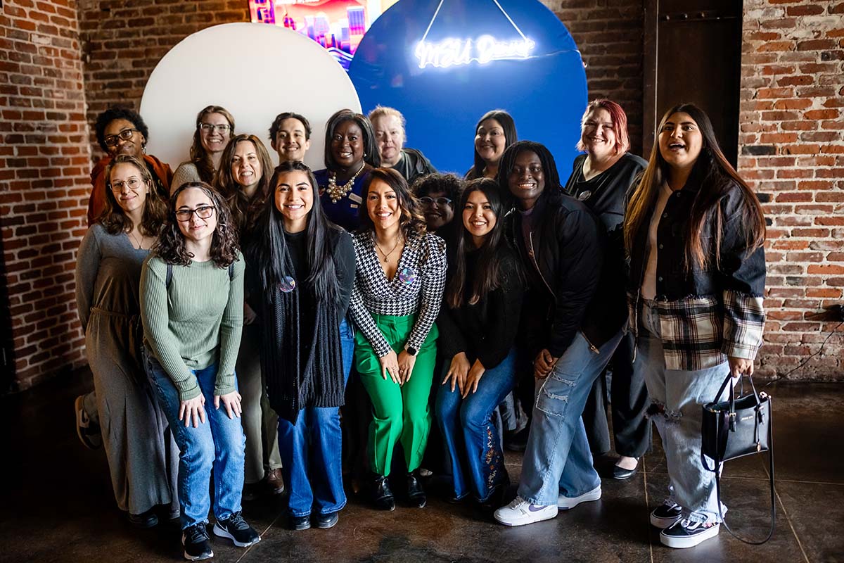 Students and staff from the Center for Multicultural Engagement & Inclusion office pose for a photo after the event.