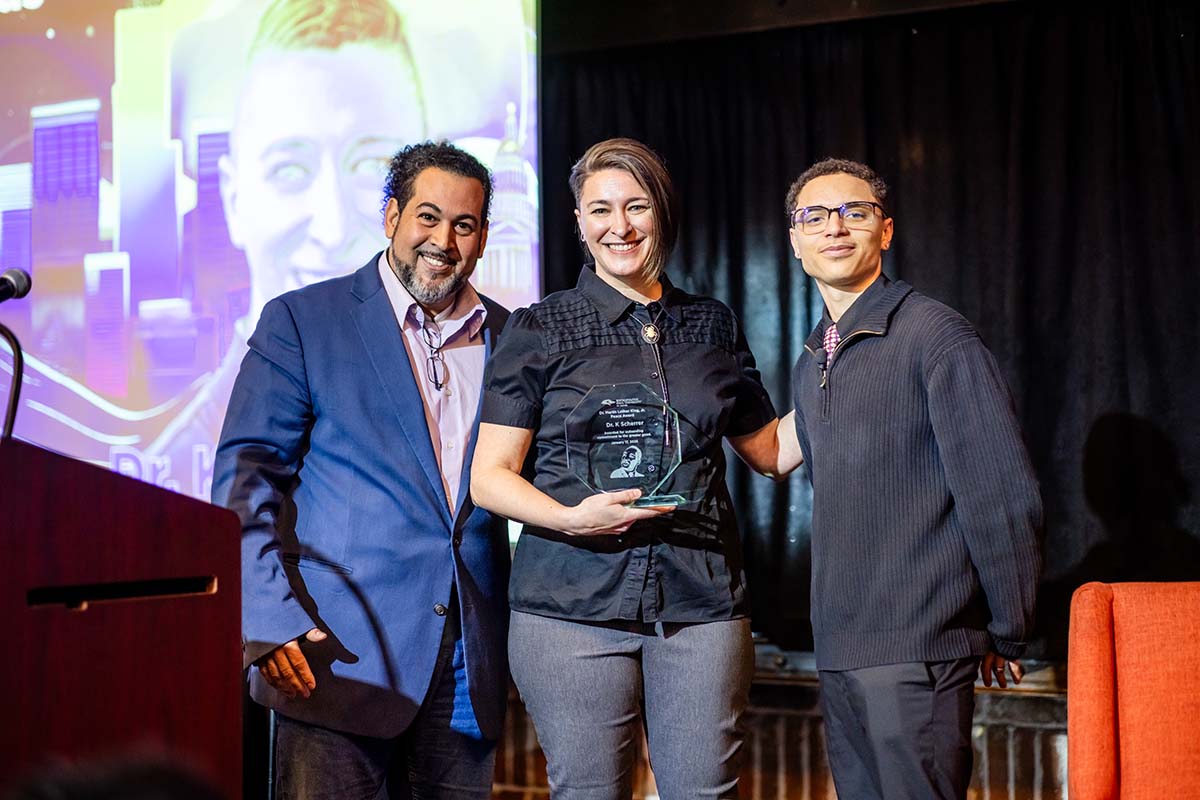 MLK Peace Awardee K Scherrer, Ph.D. center, with Michael Benitez, Ph.D., left and student Cy Holt.