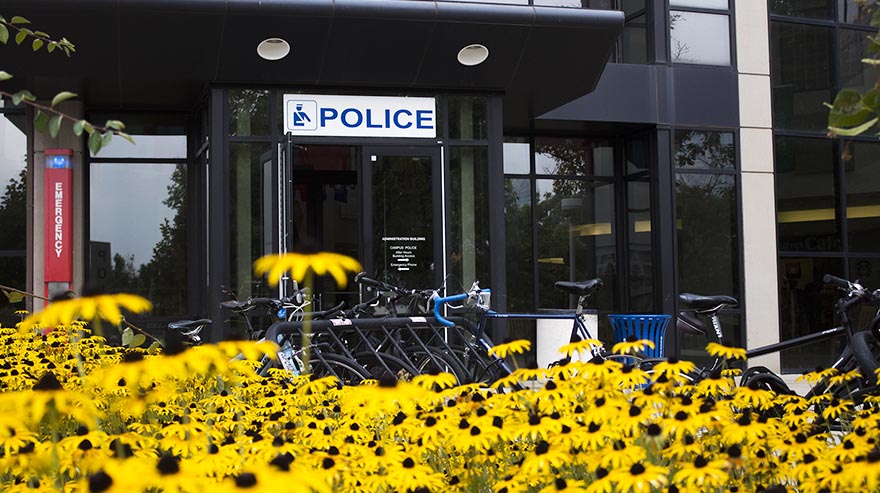 Exterior of Auraria Campus Police Department with flowers in the foreground