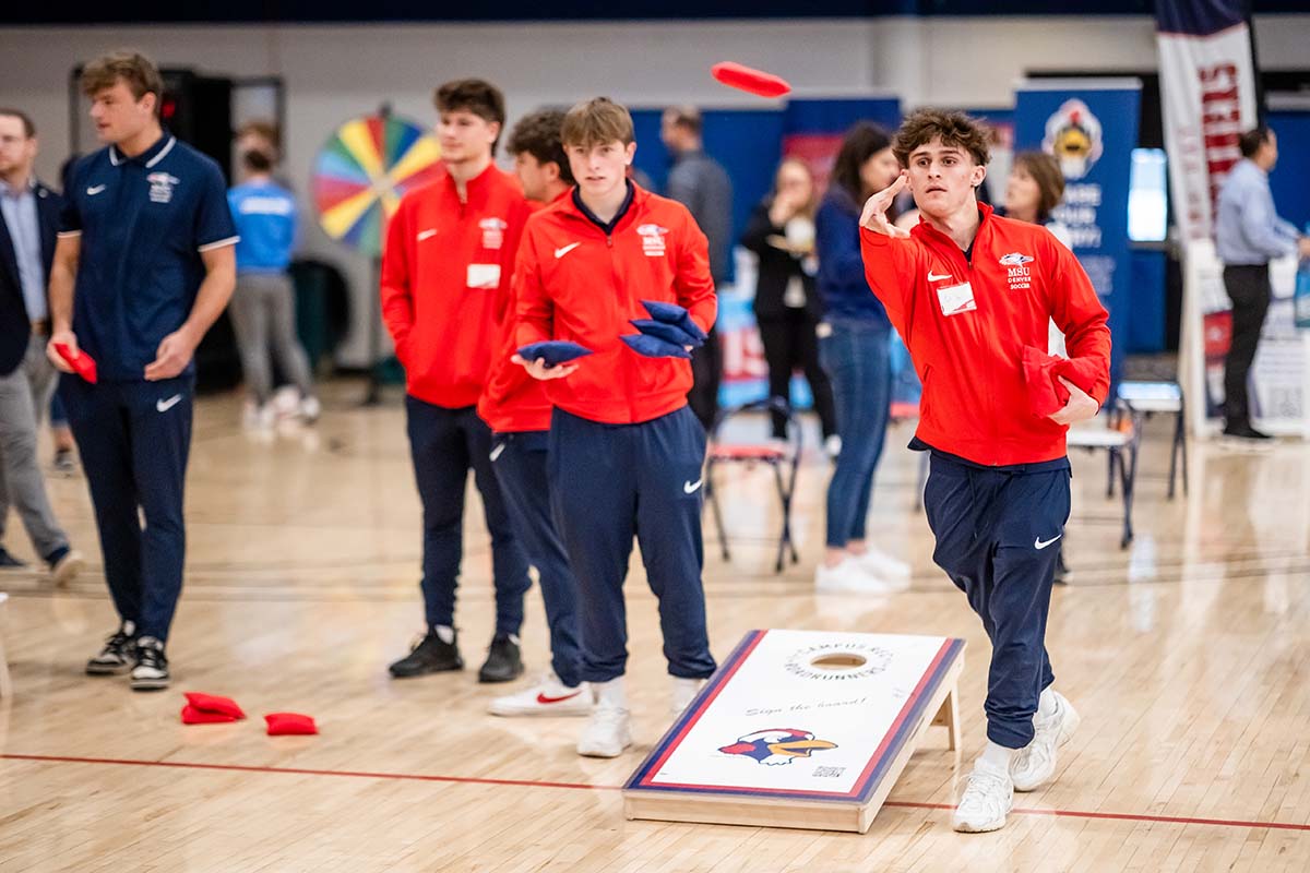 Students play corn hole