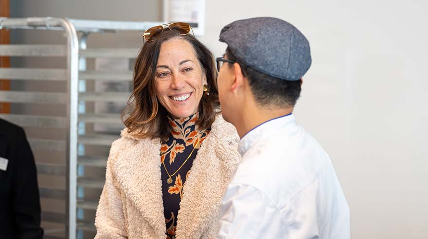 MSU Denver President Janine Davidson chats with Chef Jay Lee in the School of Hospitality