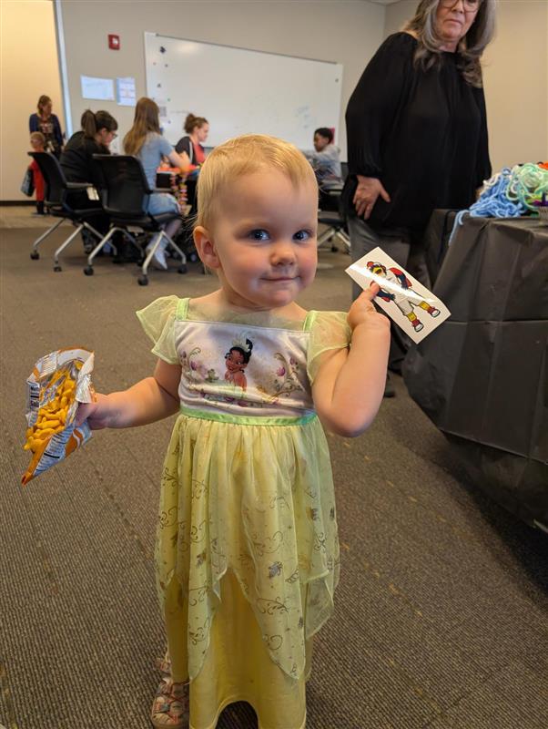 A child shows off MSU Denver swag on Bring a Child to Work Day.