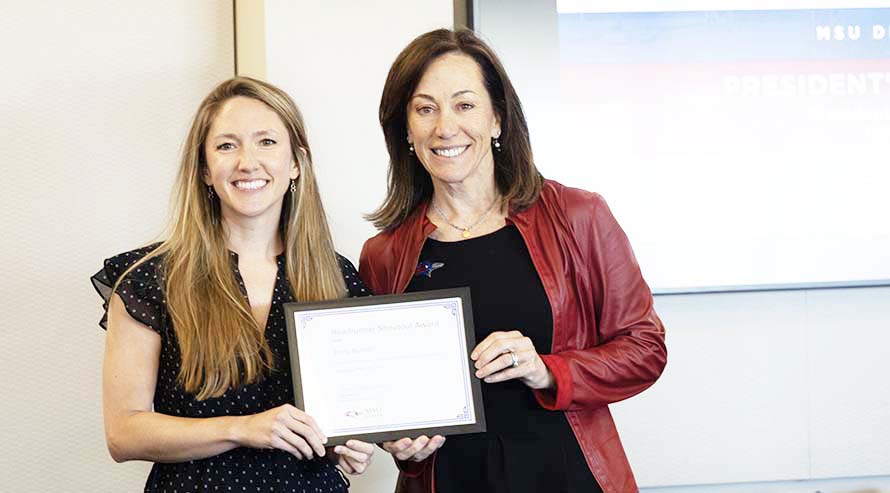President Janine Davidson, Ph.D., and Roadrunner Shoutout Staff Award winner Emily Burnell