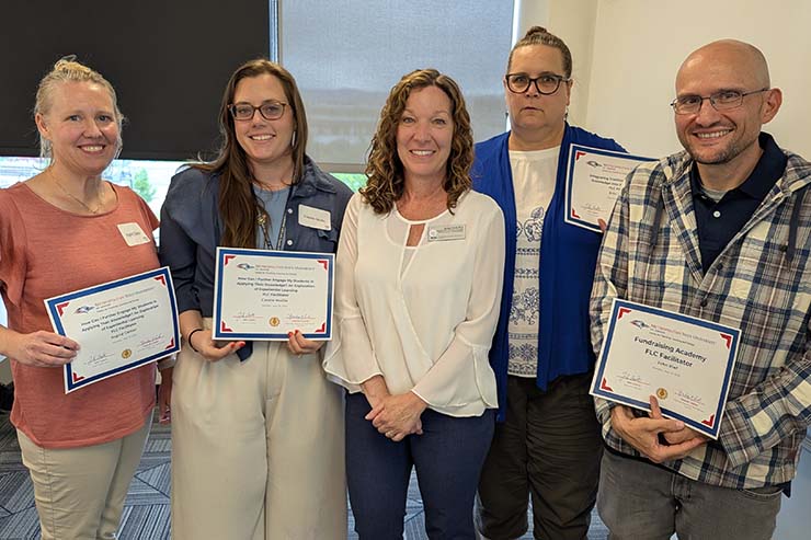 Five professors pose with certificates at the CTLD Celebration of Faculty