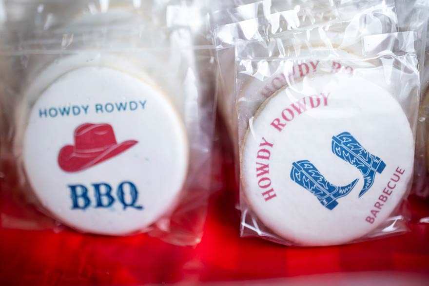 Cookies decorated with cowboy hats and boots.