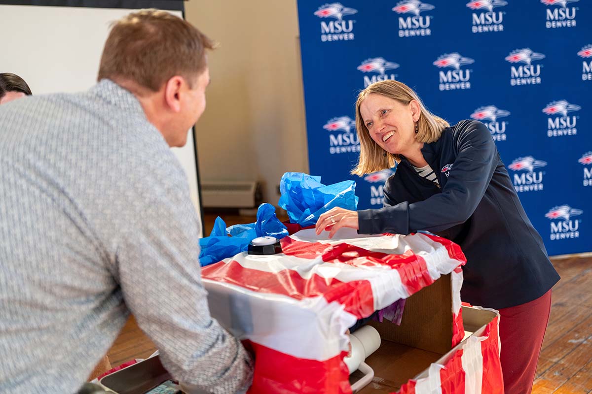 Student Affairs staff compete for a prize guessing a mystery item on feel only.