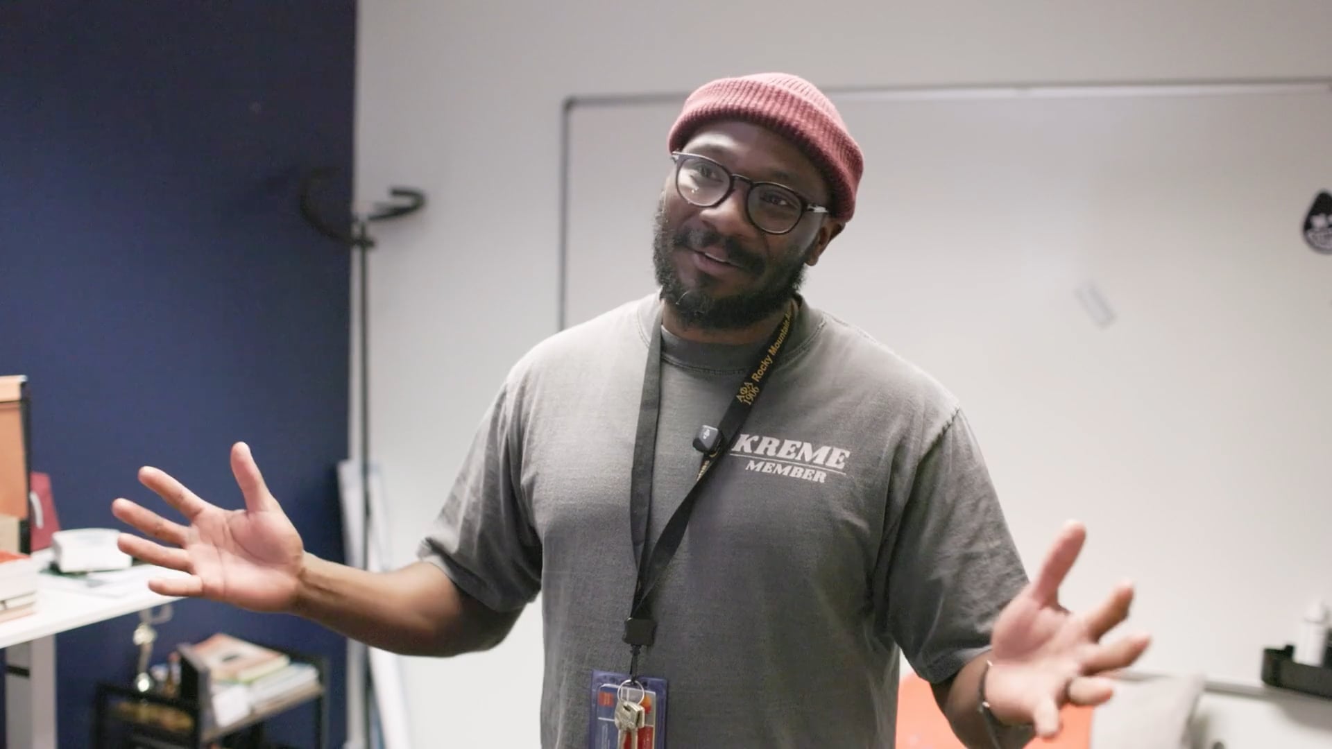 An MSU Denver employee giving an interview and gesturing with his arms.