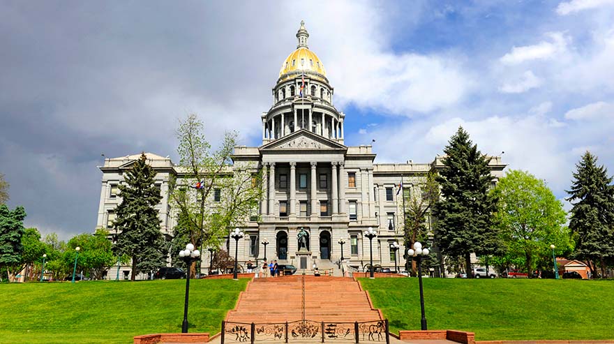 Tourists and visitors show walking around the State Capitol Building Denver Colorado