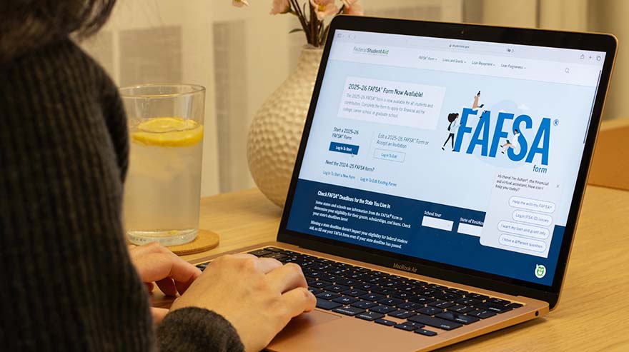Applying for financial aid on laptop