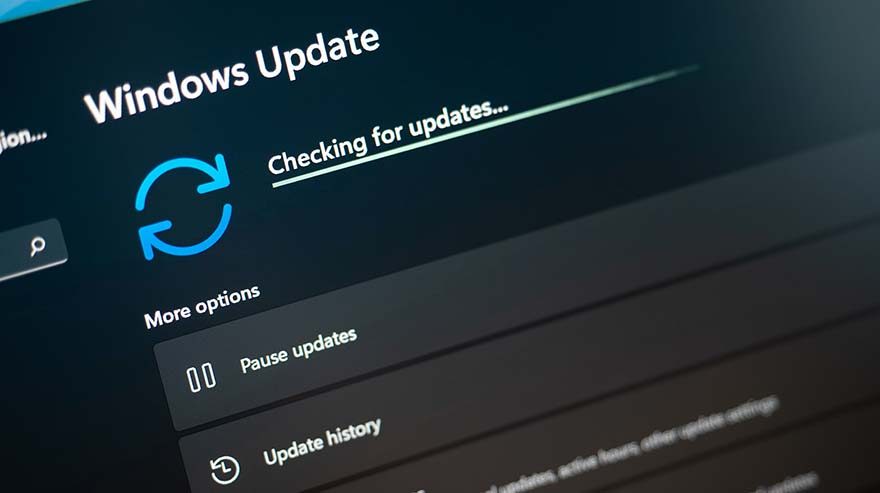 Checking for Windows 11 updates on laptop screen close up view