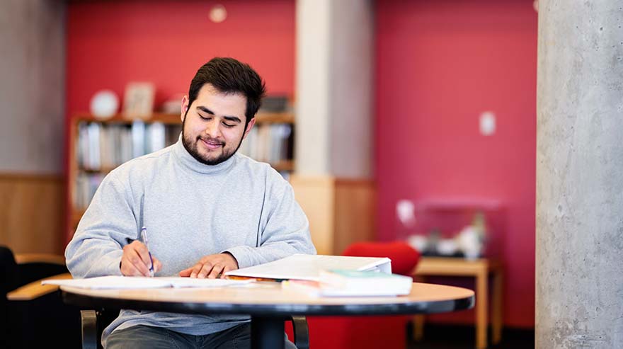 Student studying at table