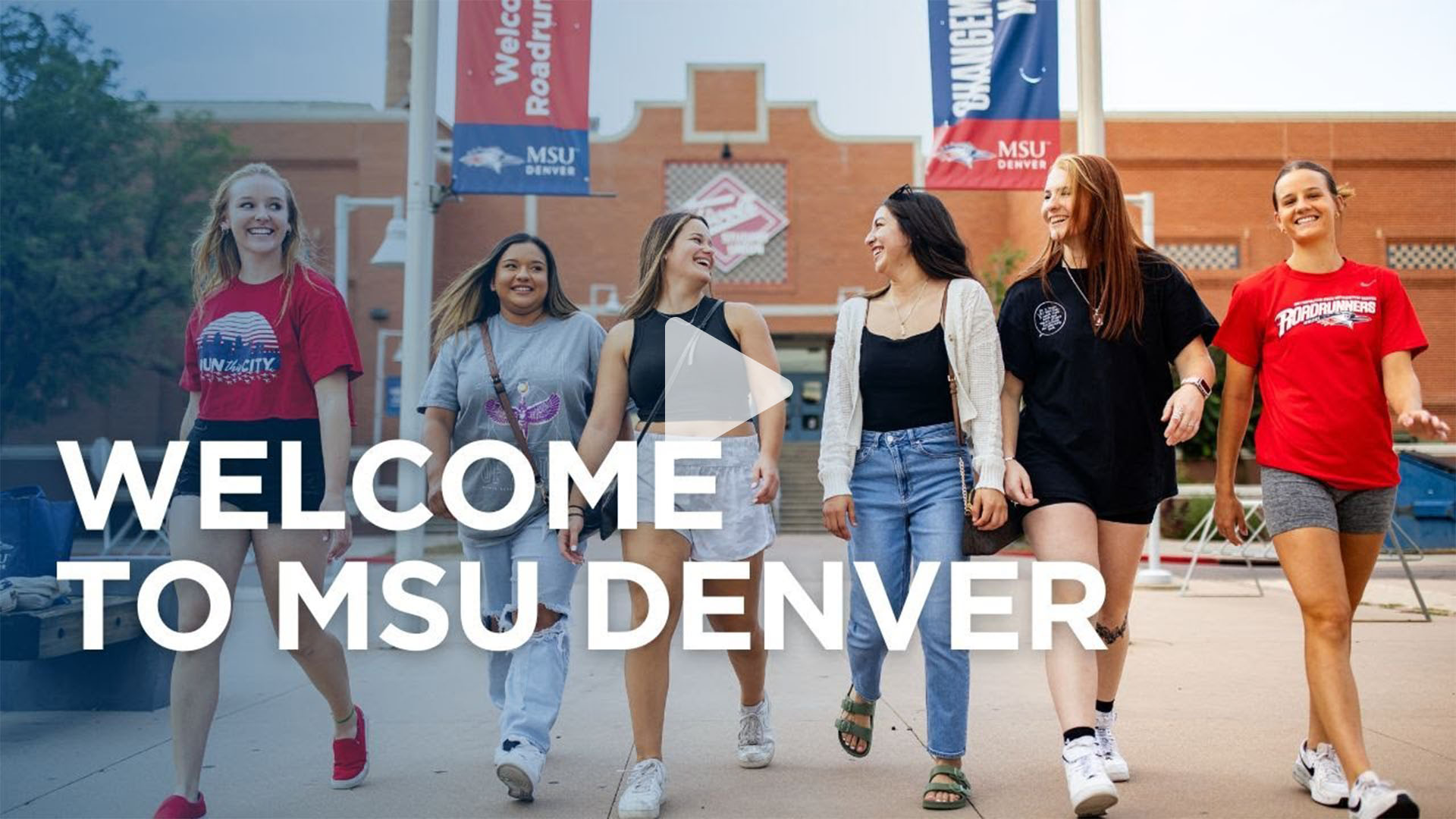 A group of six students smile and walk together on the MSU Denver campus beneath banners that say “Welcome Roadrunners” and “Changemaker.” Large text at the bottom reads “Welcome to MSU Denver.”