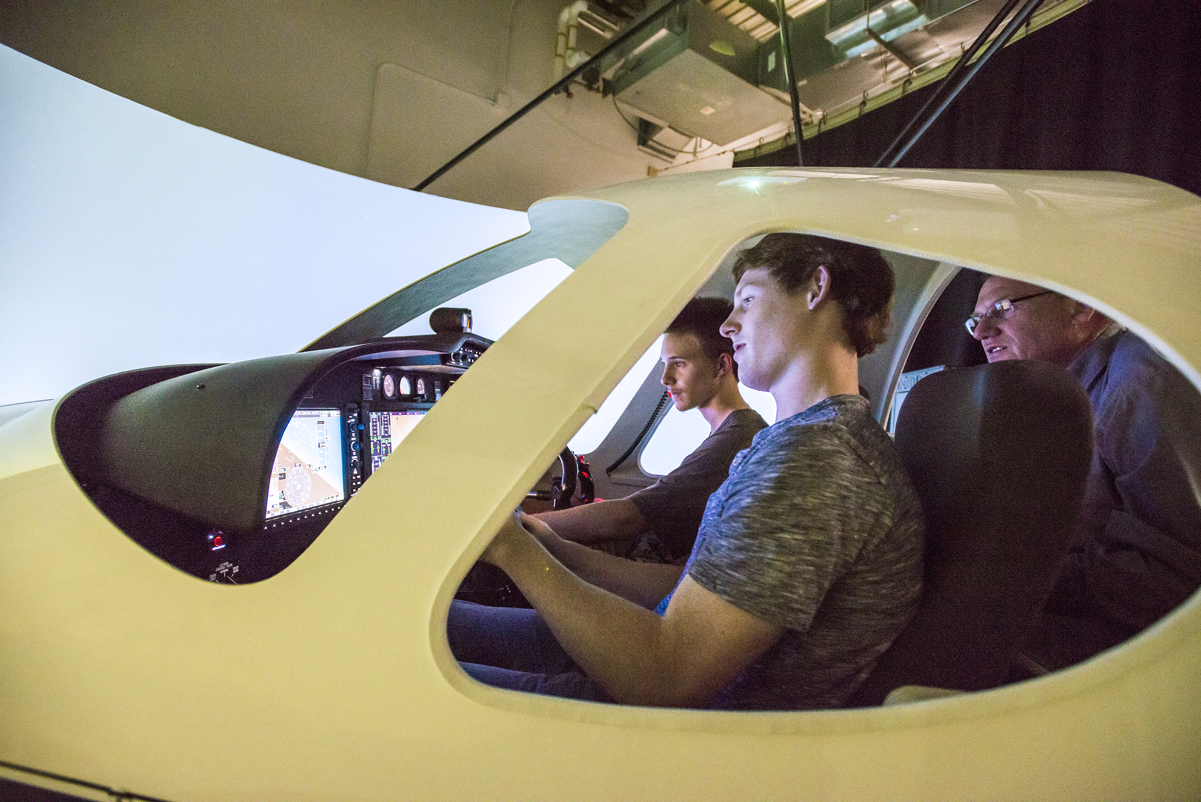 Students try out the airplane simulation in the School of Aviation and Aerospace