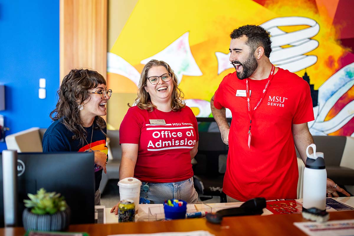 Smiling staff at convocation