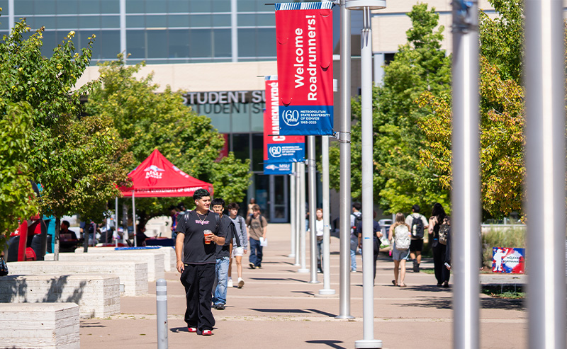 Students walking out front of the Jordan Student Success Building.