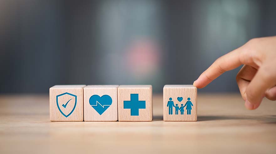 Protection and insurance concept car home and health, wooden blocks with drawings