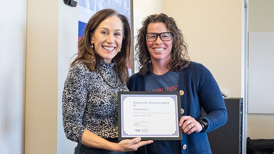 Dr. Janine Davidson presents the Roadrunner Shoutout Award to Brandi Rideout.