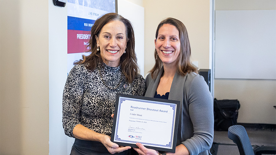Dr. Janine Davidson presents the Roadrunner Shoutout Award to Kristin West.