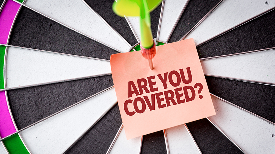 Photo illustration of a dart board with dart on the bullseye and a sticky note that says 'are you covered?'