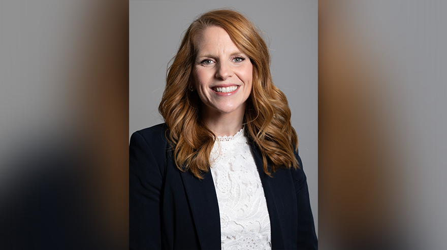 Headshot of Scherzenberg, newly named AVP of Enrollment Management, smiling in front of a neutral studio backdrop.