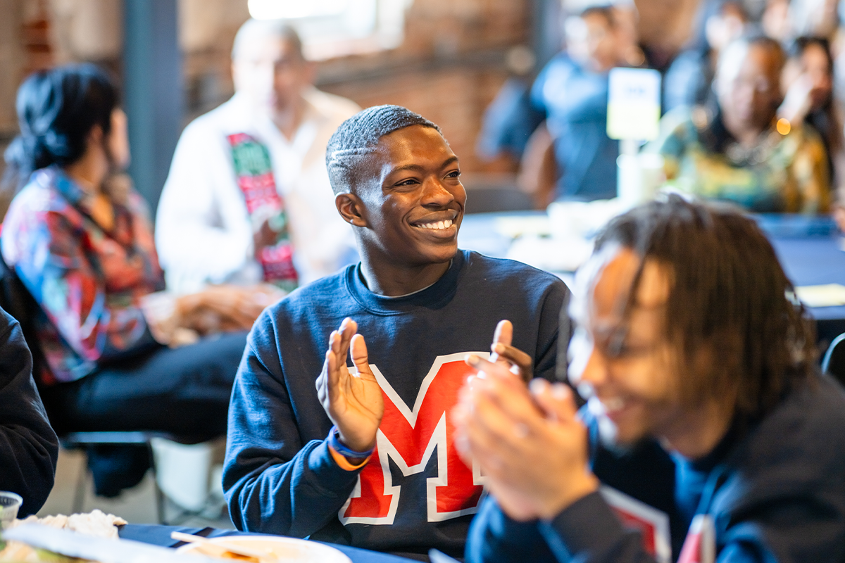 Highlights from the MLK Peace Breakfast, including speakers on stage and attendees participating in the event