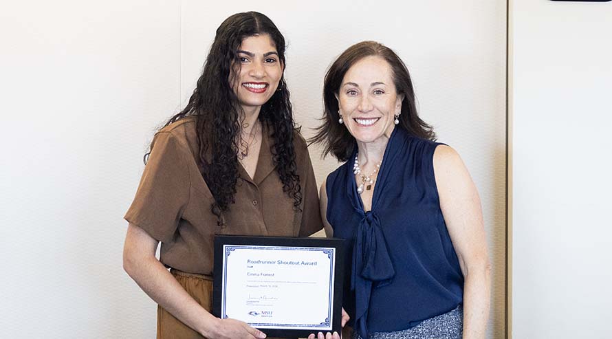 President Janine Davidson, Ph.D., with Roadrunner Shoutout Award Staff winner Emma Forrest.