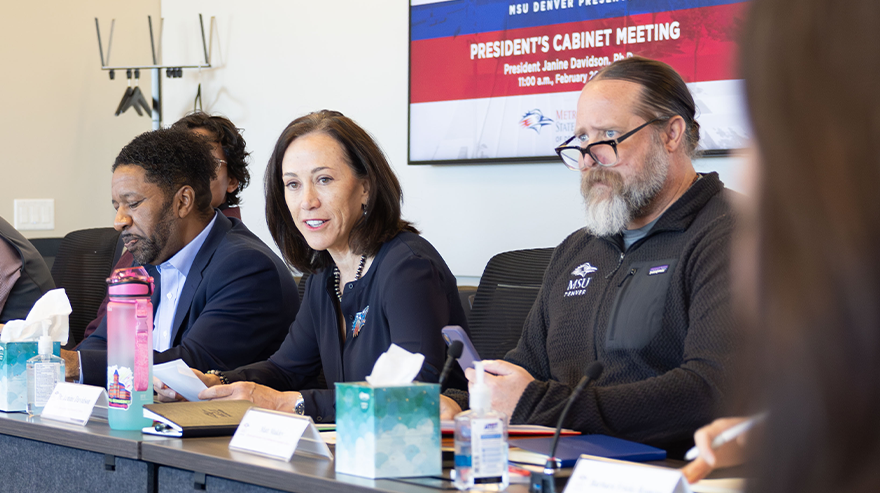 MSU Denver President Janine Davidson speaks during a President’s Cabinet meeting while seated at a conference table with other university leaders.