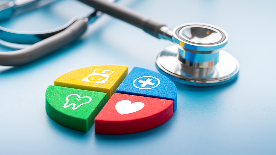 Stethoscope next to colorful health icons representing dental, medical, and heart care on a blue surface.