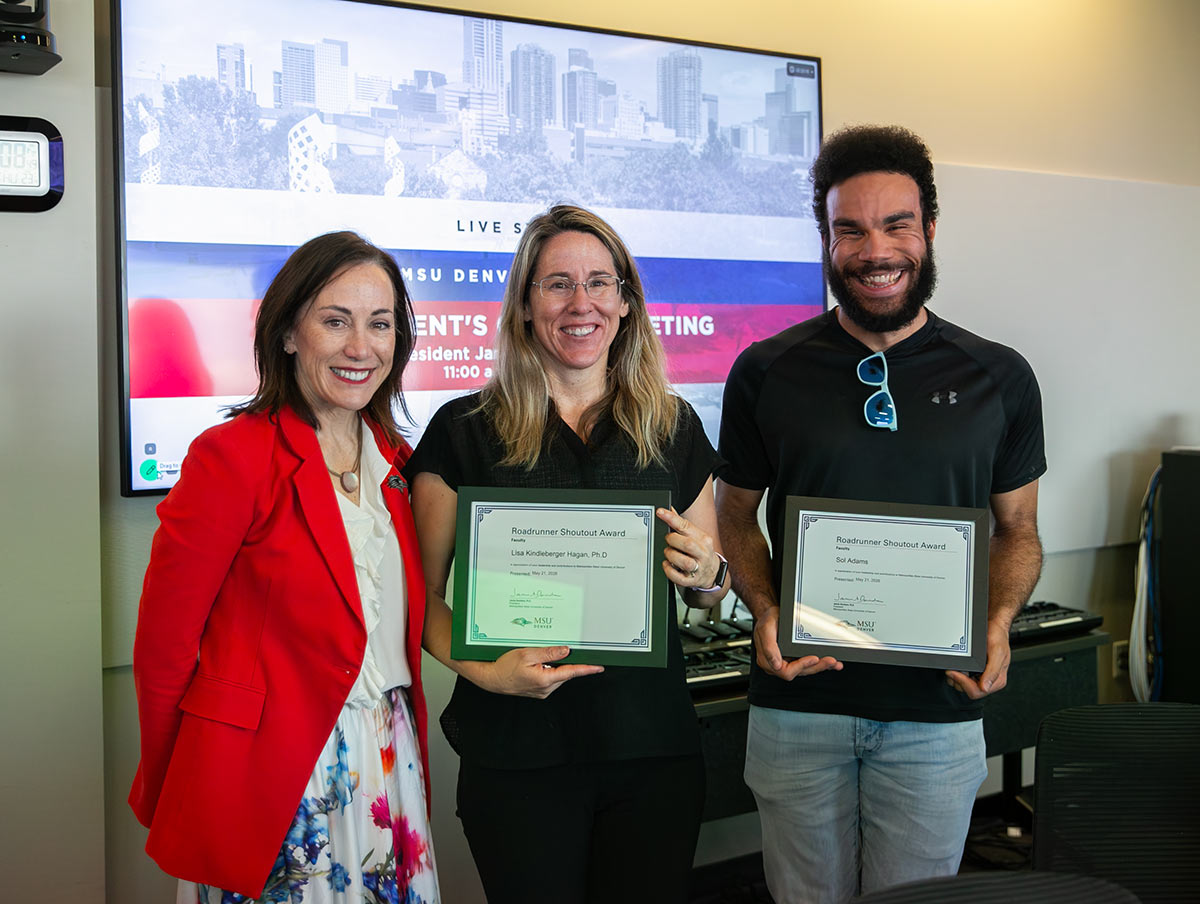 Sol Adams, lecturer in the Department of Psychological Sciences, and Lisa Hagan, Ph.D., professor of Psychological Sciences, hold Roadrunner Shoutout awards next to Presidnet Janine Davidson.