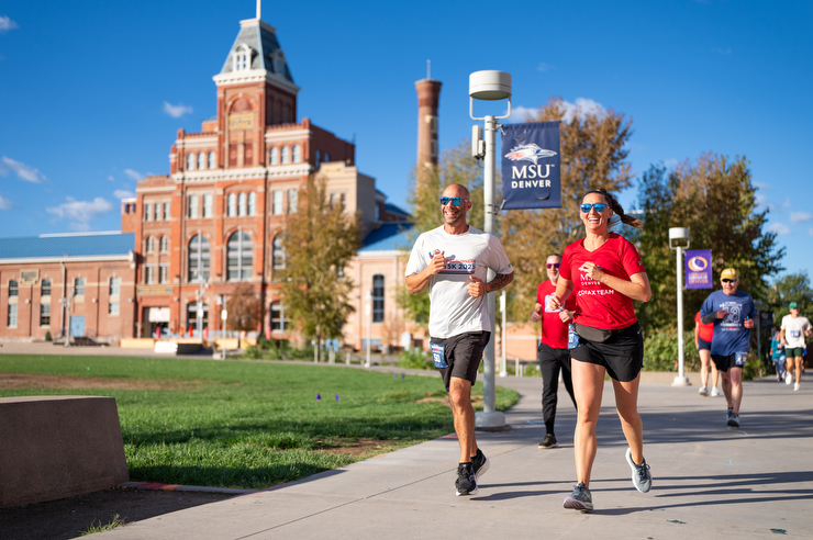Roadrunners run past the Tivoli during the annual 5k.