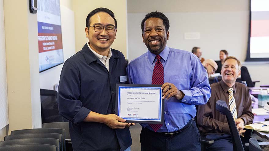 Chief of Staff Edward Brown, Jr., with Roadrunner Shoutout Award faculty winner Jangwoo 'JJ' Jo.