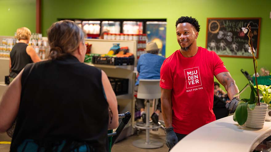 Assistant Vice President of Student Success Nahum Kisner volunteers at Metro Caring.