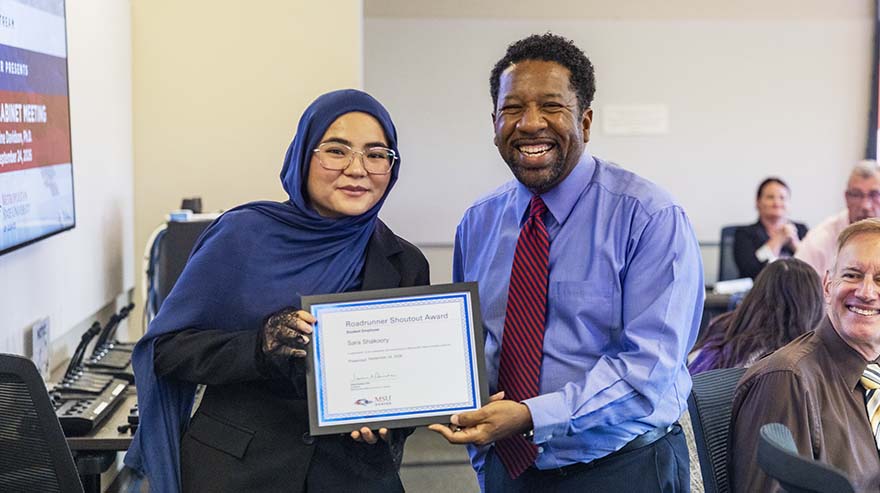 Chief of Staff Edward Brown, Jr., with Roadrunner Shoutout Award student winner Sara Shakoory