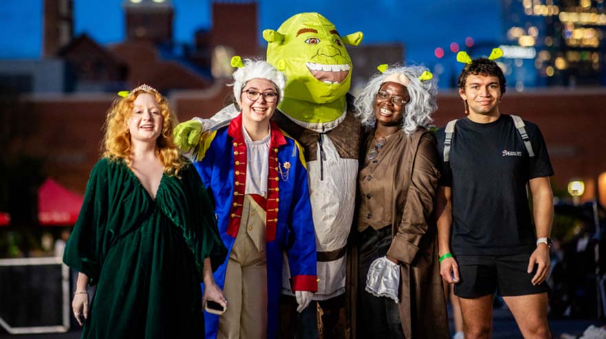 Students dress up for Shrek movie outdoors on campus